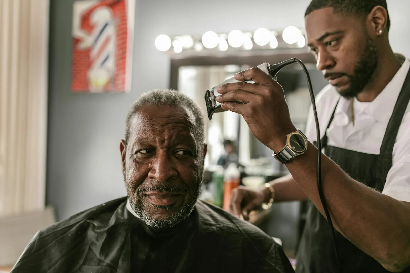A Locale barber gives a regular client a fresh cut, Bed-Stuy