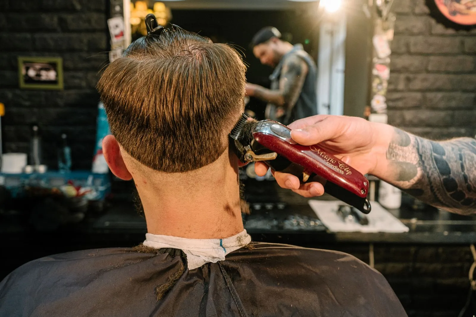 A taper finished against the shop brick wall at Locale