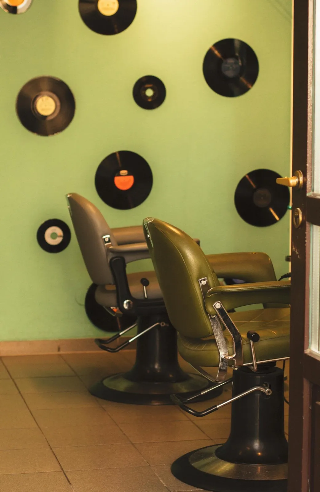 Vinyl records on the wall behind the chairs